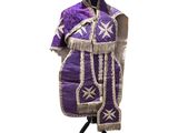 an image of a purple and white dress on a mannequin stand