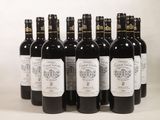 six bottles of wine are lined up in a row on a white surface