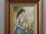 tableau représentant une femme en robe bleue avec des fleurs, dans un cadre doré