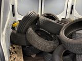 a lot of tires in the back of a van