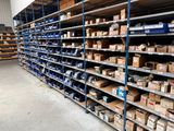 a large amount of boxes on the shelves in the warehouse