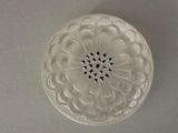 a white plate with a flower design on it