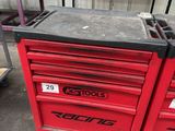a red tool box sitting on top of a table