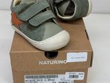 baby boy ' s shoes in a box on a white surface