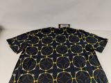 a black shirt with a yellow and pink pattern on it