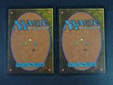 two decks of magic the gathering deck are shown on a table