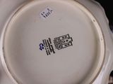 a white plate with a blue and white design on it