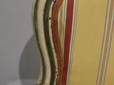 striped upholstered chair with wood frame and wood feet