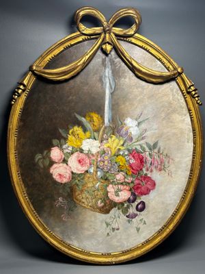 painting of a basket of flowers in a gold frame on a wall
