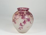 purple and white glass vase with flowers on a white background