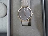 a watch that is in a box on the table