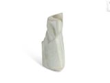 a white marble sculpture of a cat on a white surface