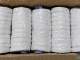 a box full of rolls of toilet paper sitting on top of a table