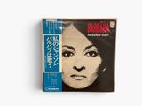 a close up of a book with a picture of a woman ' s face