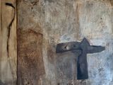 a painting of a cross on the wall of a building