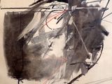 a black and white drawing of a face on a piece of paper