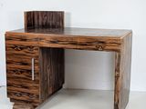 a wooden desk with a drawer on top of it