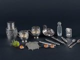 a lot of silver objects that are on the table