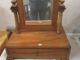 someone is taking a picture of a small wooden vanity with a mirror on it