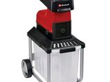 un gros plan d'une machine rouge et noire sur fond blanc