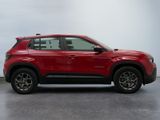 a red 2021 chevrolet traverse suv parked in a garage