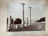 a picture of a black and white photo of some columns