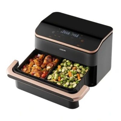 une friteuse à air chaud noire et dorée contenant des aliments