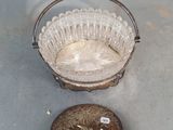 a glass bowl and a metal bowl on a table