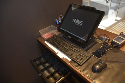 a desk with a laptop and a keyboard on it