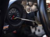 a close up of a steering wheel with a wren in it