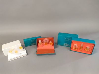 four small boxes with different designs on them sitting on a table