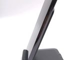 a cell phone that is sitting on top of a stand
