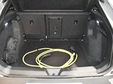 a trunk of a car with a hose in the trunk