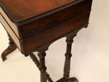 an old wooden table with a drawer on top of it