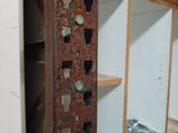 a rusted metal object in the corner of a room