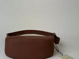 a brown leather belt with a white tag on it