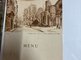 a picture of a menu on a table in a restaurant