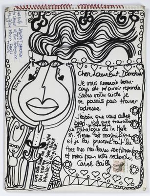 a black and white drawing of a woman ' s face on a piece of paper