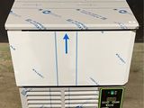 an image of a freezer sitting on top of a floor