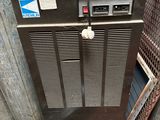 a small air conditioner sitting on top of a pallet