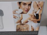 a box with a picture of a woman using an electric device