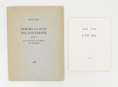 an old book sitting on top of a white table next to a book