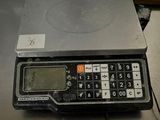 a scale with a calculator on top of it