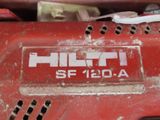 a close up of a red power tool with a sticker on it