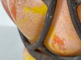 a close up of a vase with a wire wrapped around it