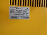 a label on the back of a yellow machine