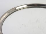 a silver tray with a silver handle on a white table
