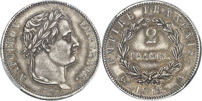 gros plan d'une pièce de monnaie sur laquelle figure un visage de femme