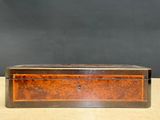 an old wooden box sitting on top of a table