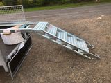 an image of a truck with a ramp attached to it